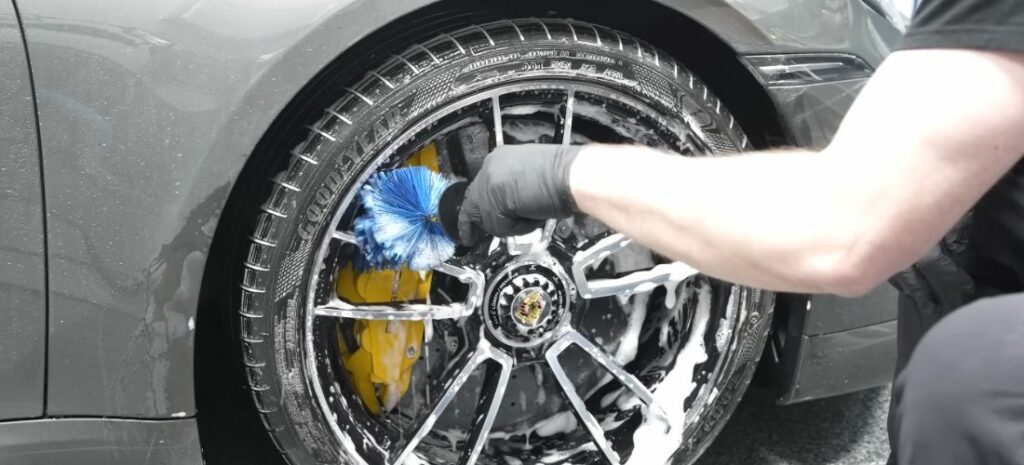 Zoom in on the meticulous cleansing of a car's inner wheel chambers, where precision meets purification.