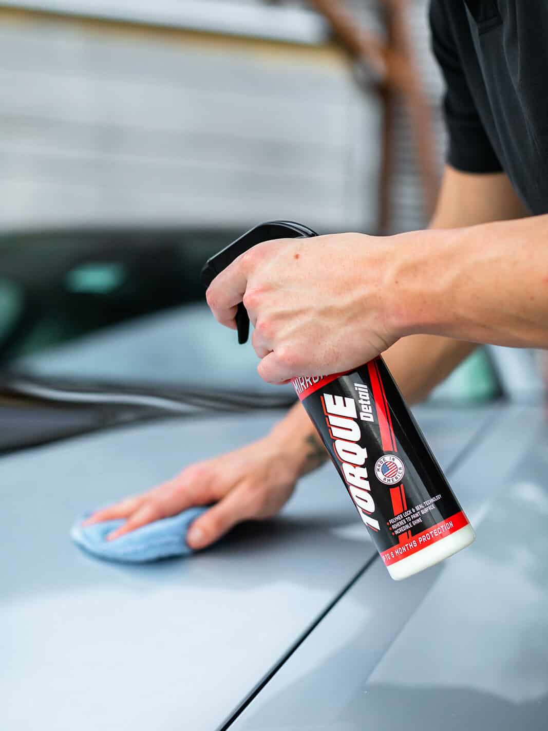 Applying Torque Detail Mirror Shine on a car.