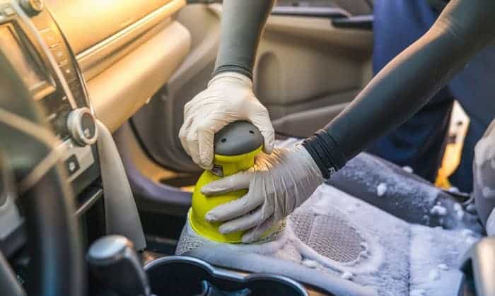 Shampooing car's seat.